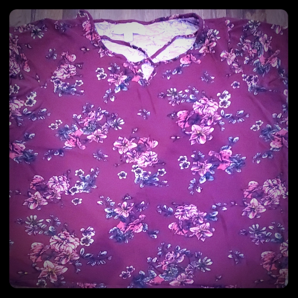 A maroon flowered shirt